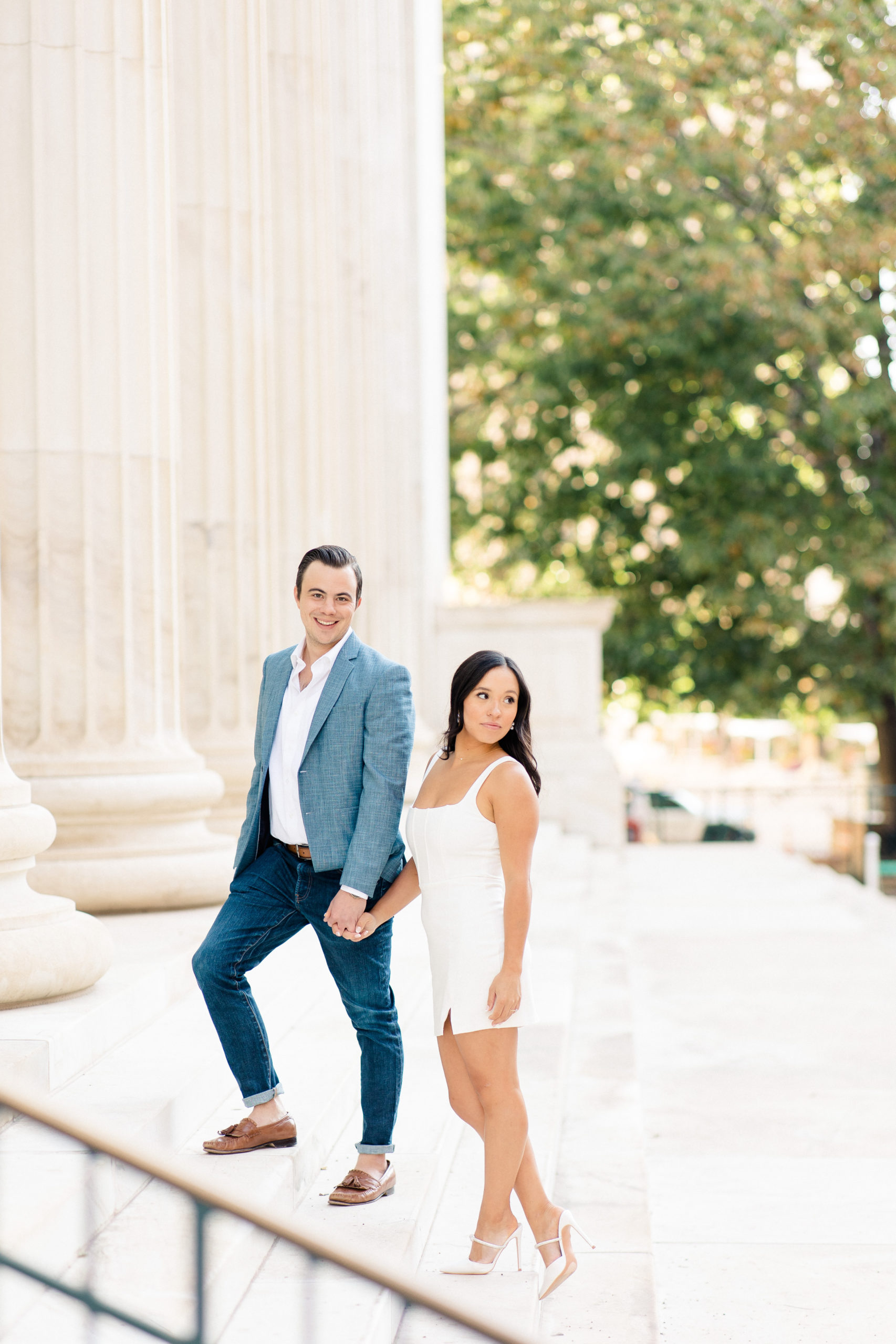 Classy engagement portrait of couple on steps in Denver