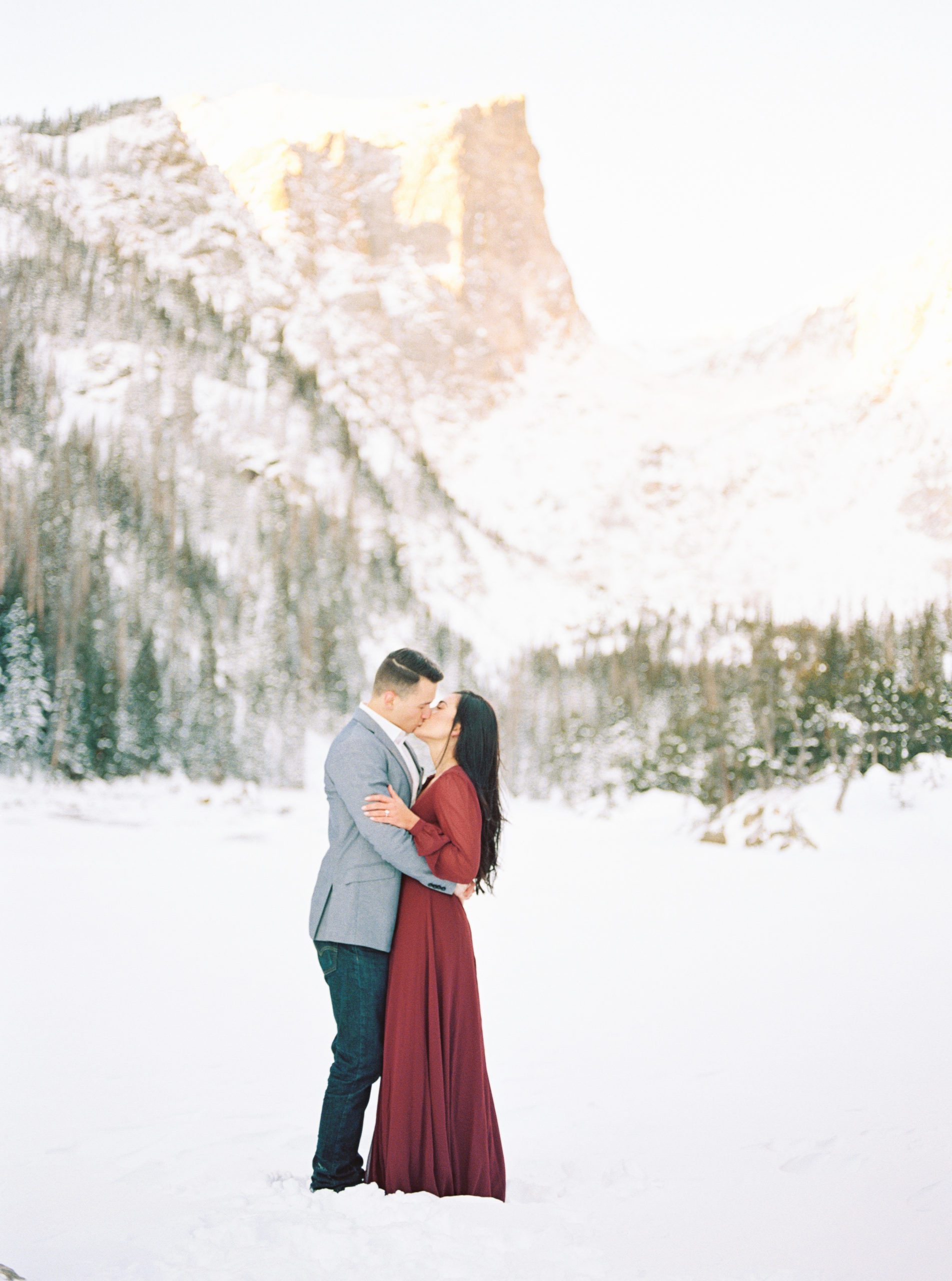 Film image of couple in winter mountain scene in Estes Park