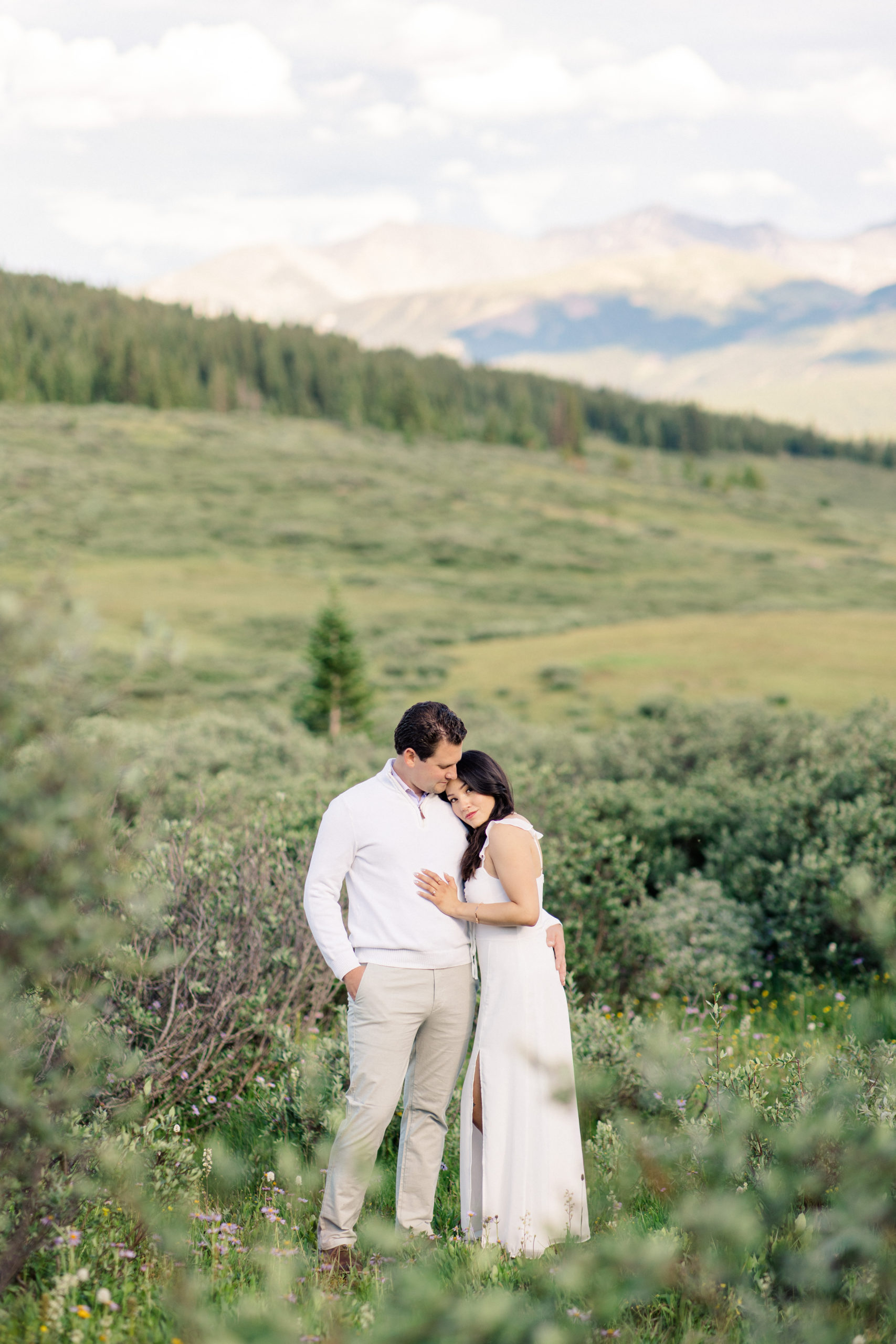 Engagement portrait in vast Vail mountain setting in the Summer