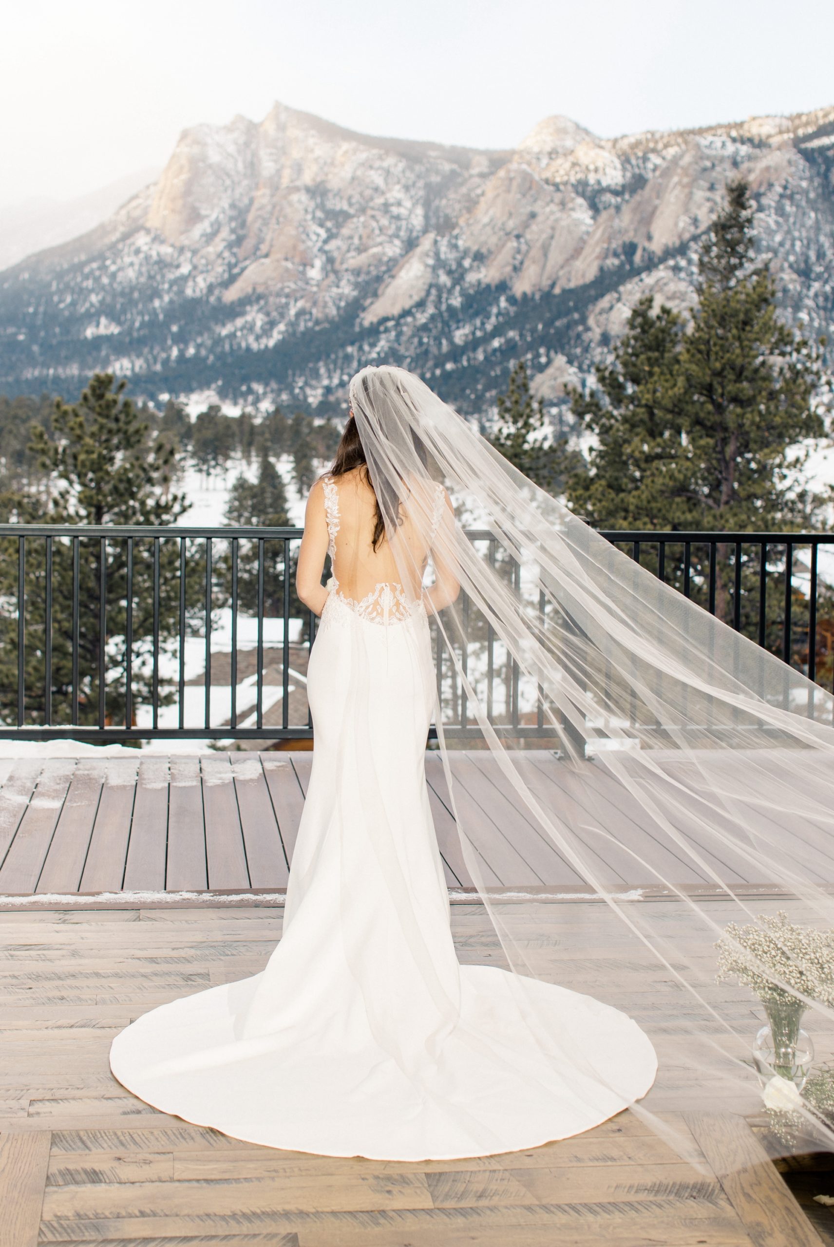 Bridal portrait of bride facing mountains on deck at the Boulders at Black Canyon Inn
