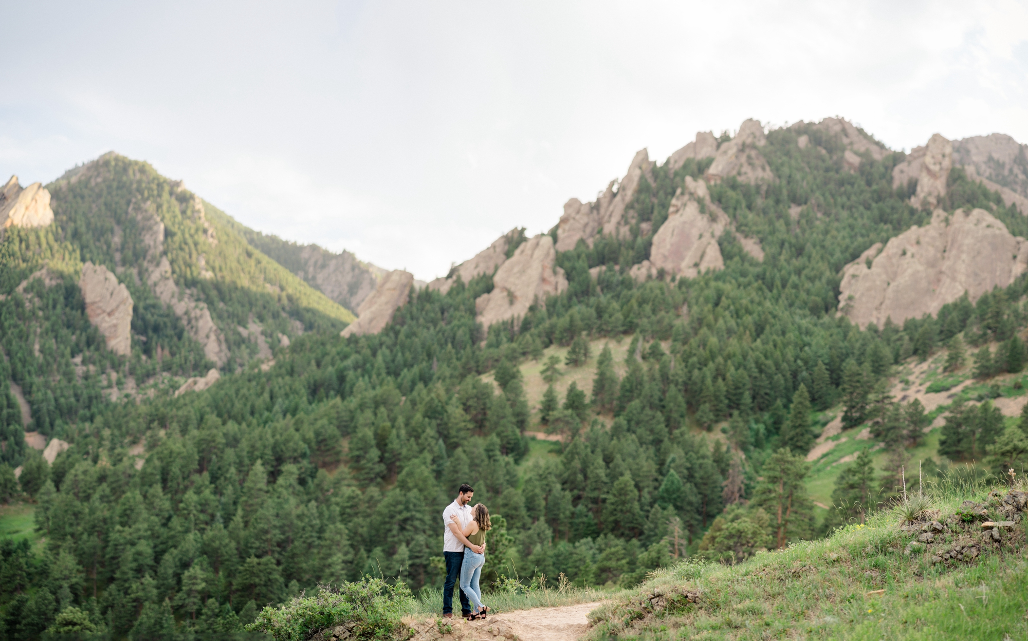 Engagement photo of a couple in the Boulder Flatirons