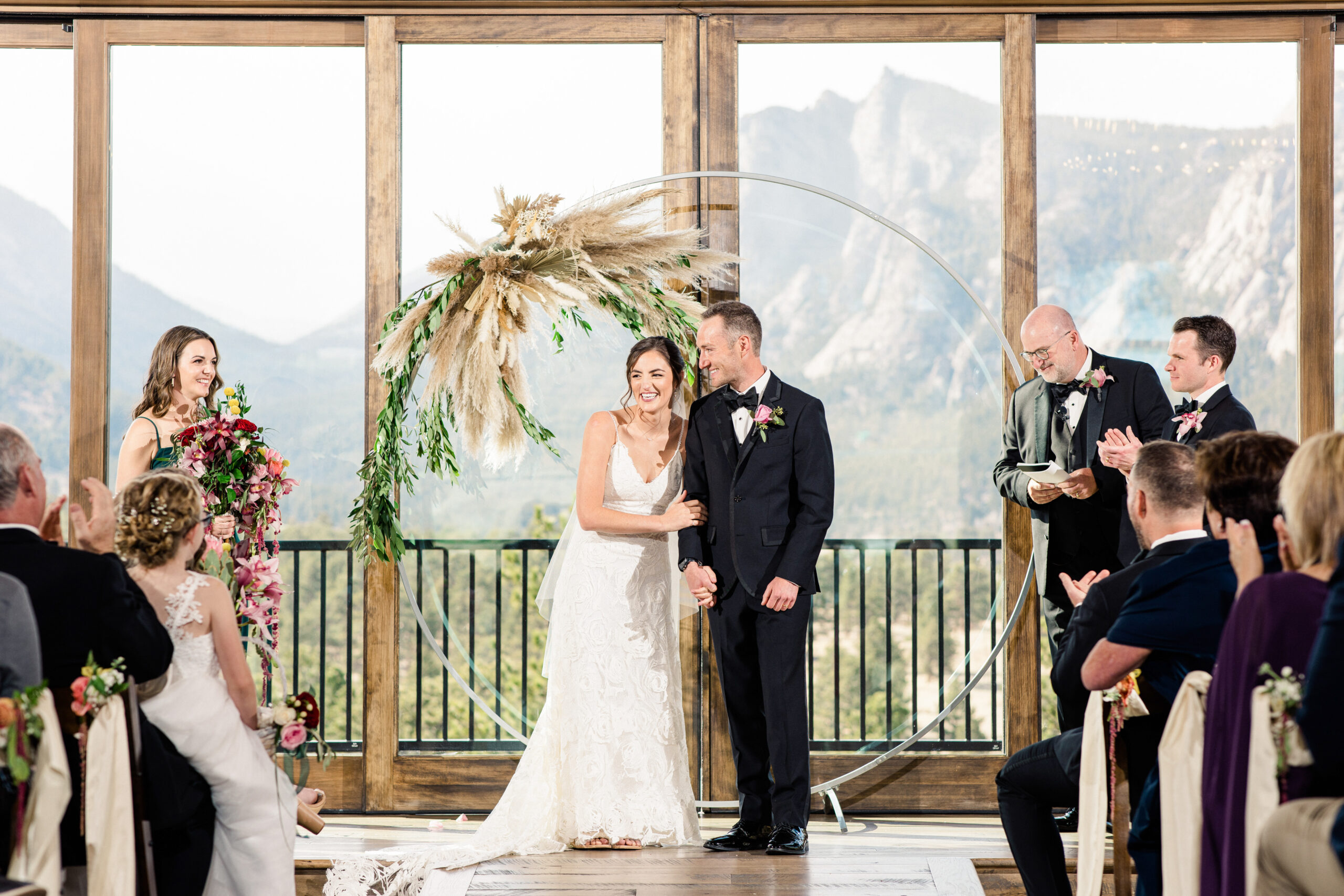 Couple during their wedding ceremony at the Boulders at Black Canyon Inn venue in Estes Park, Colorado