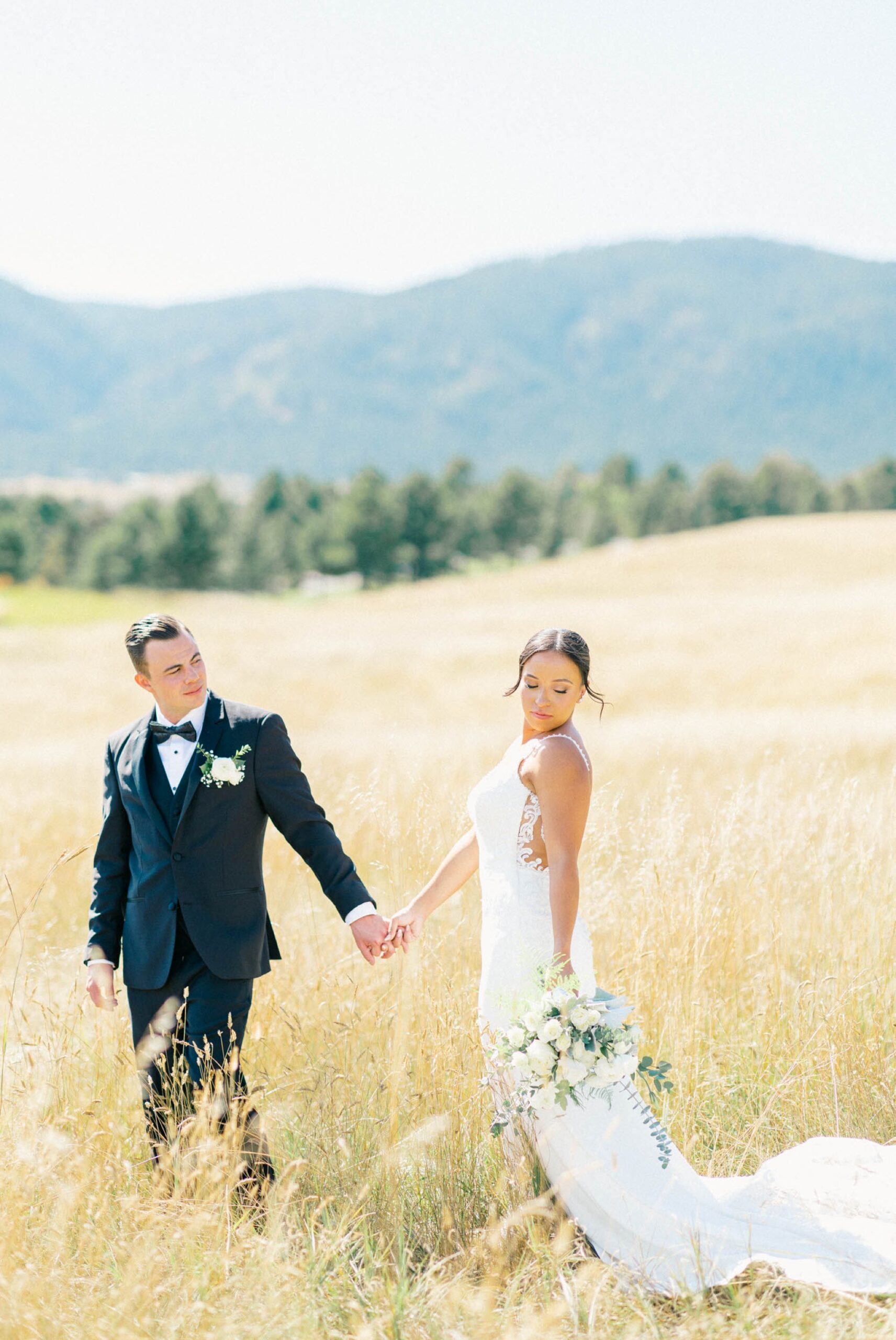 Spruce Mountains Events photo of a bride and groom in field
