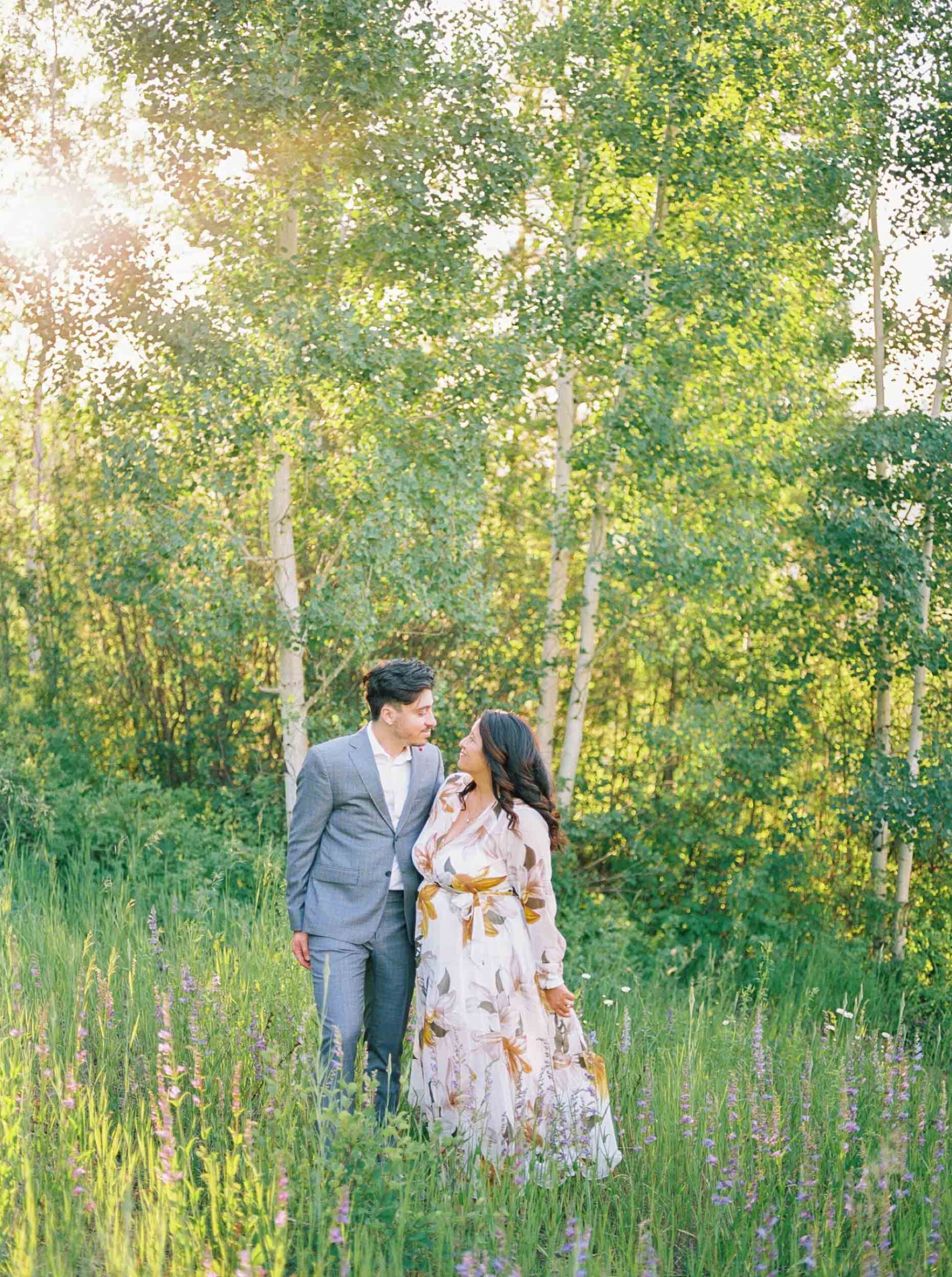 Film photo of couple in mountain field in vail engagement session